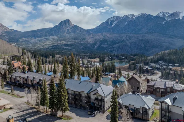 a view of a house with roof deck and sitting area