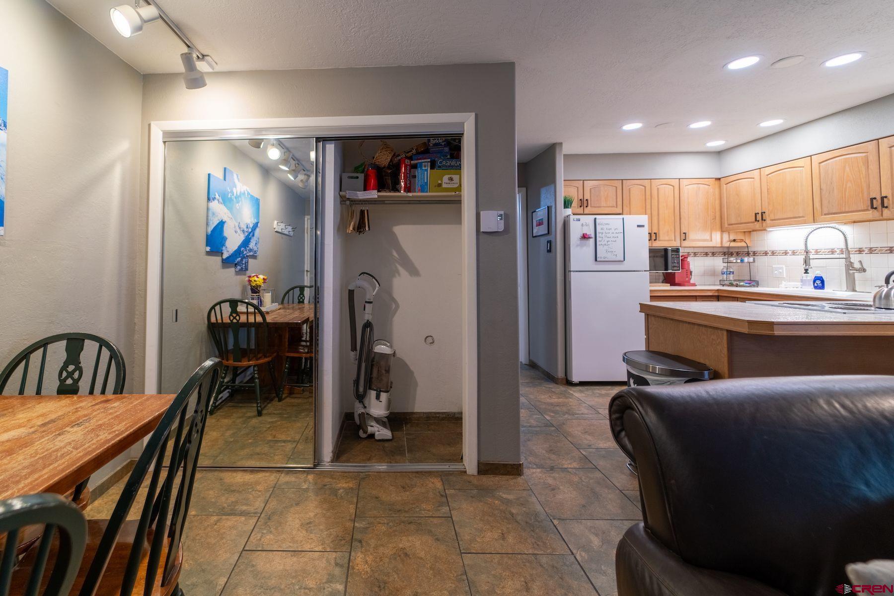 395 Sheol Street, Unit 26 Durango, CO 81301 - Photo 9 of 30 a living room with stainless steel appliances kitchen island granite countertop furniture and a kitchen view
