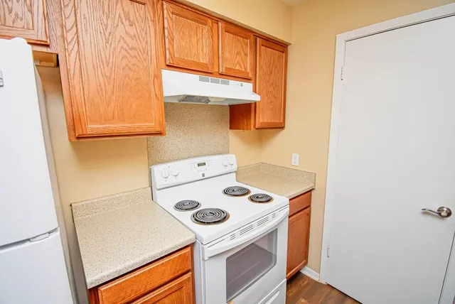 a kitchen with a stove and a refrigerator