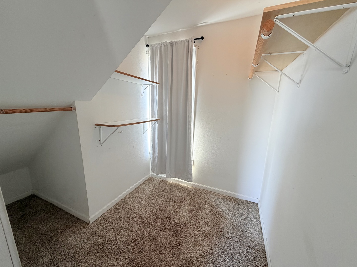 608 West Cedar Street Le Roy, IL 61752 - Photo 12 of 17 a view of a hallway with a white refrigerator