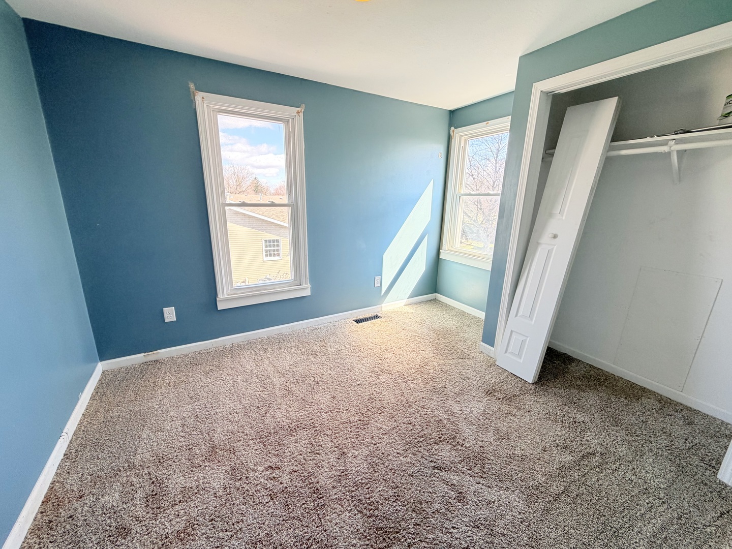608 West Cedar Street Le Roy, IL 61752 - Photo 13 of 17 an empty room with windows