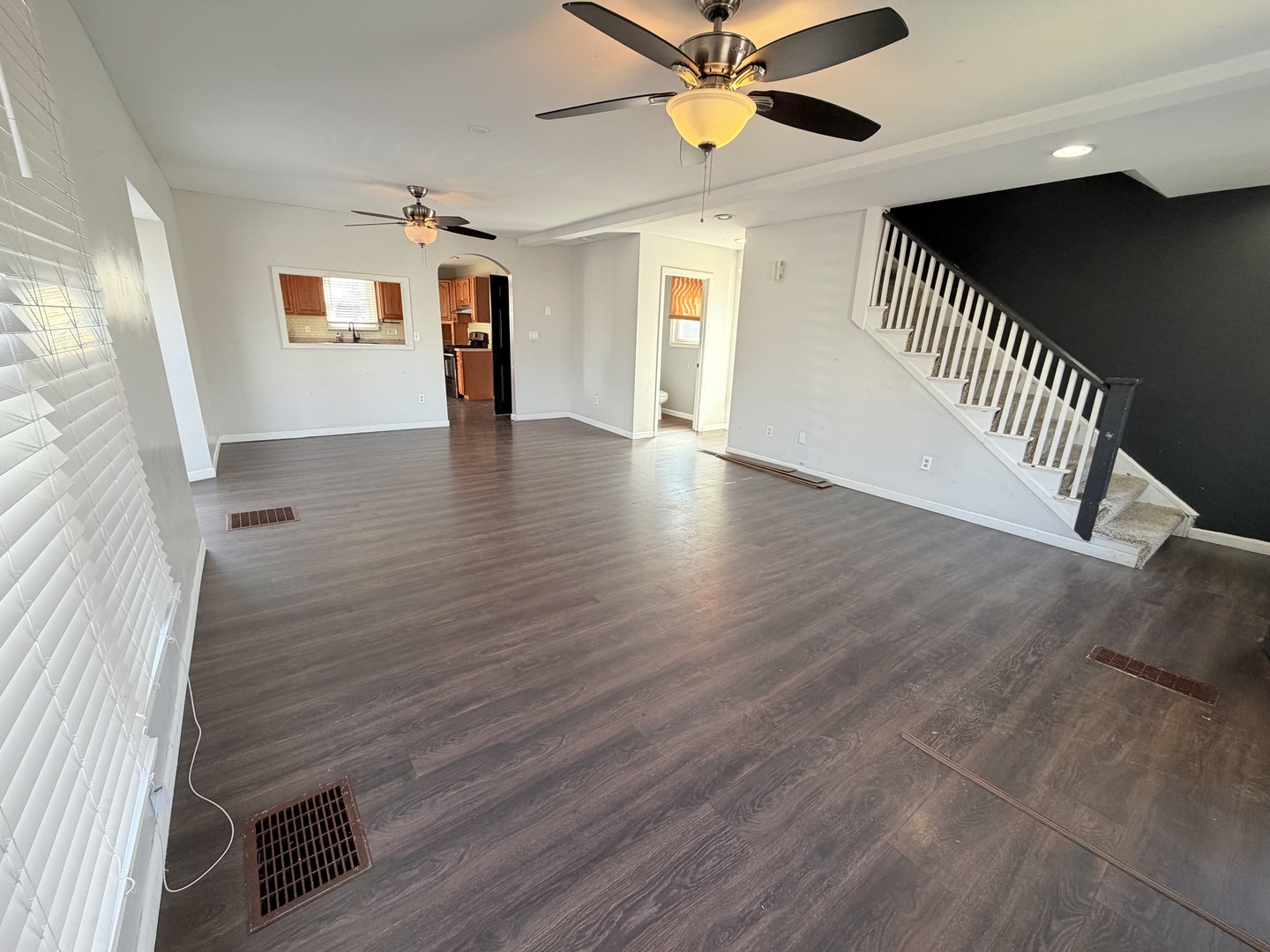 608 West Cedar Street Le Roy, IL 61752 - Photo 3 of 17 wooden floor in an empty room with a window