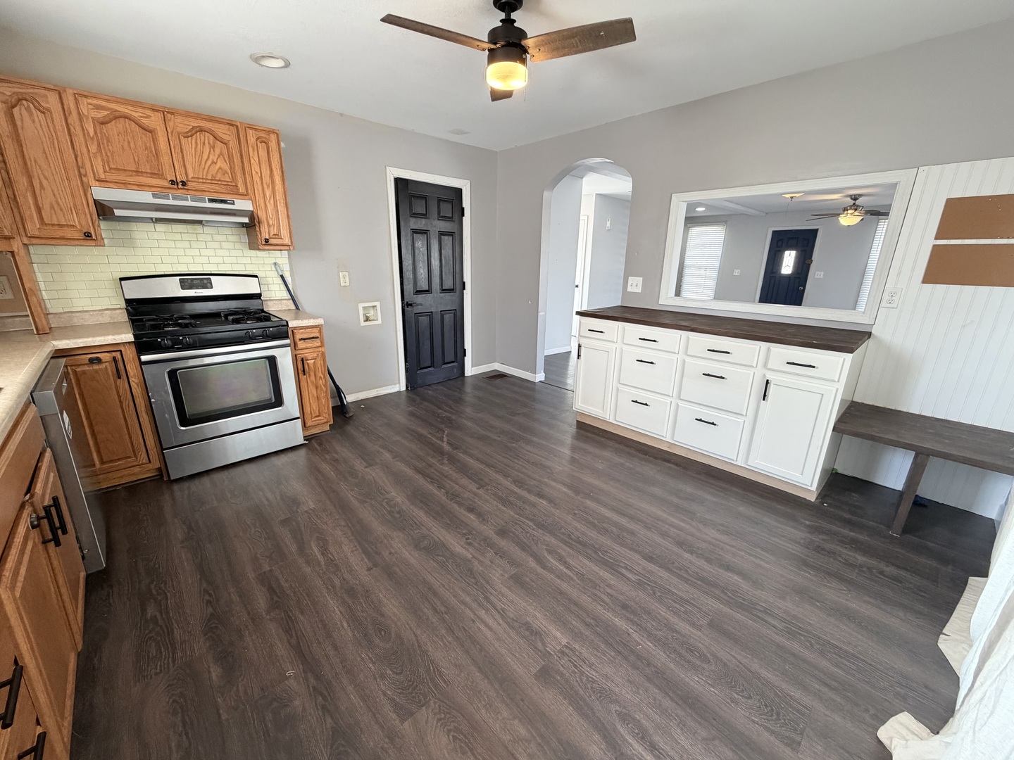 608 West Cedar Street Le Roy, IL 61752 - Photo 5 of 17 a kitchen with stainless steel appliances a stove top oven and a wooden floors
