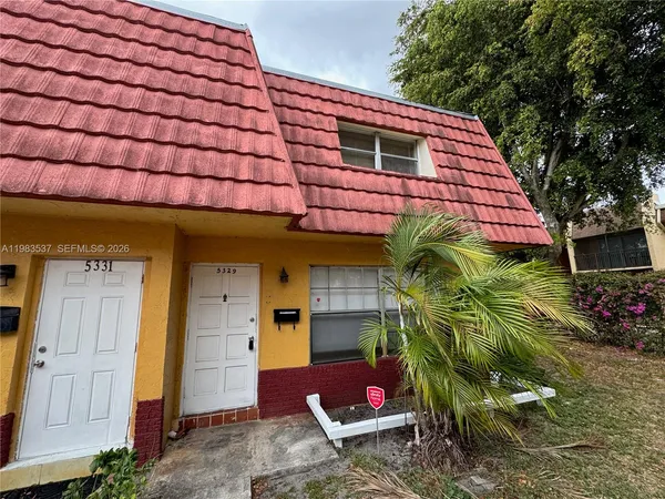 a backyard of a house with seating space