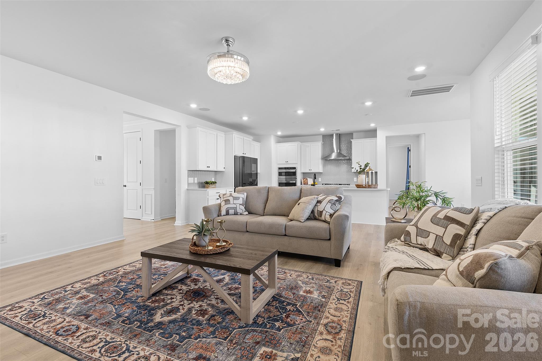 1170 Sugar Crk Road Fort Mill, SC 29707 - Photo 14 of 47 a living room with furniture wooden floor and a rug