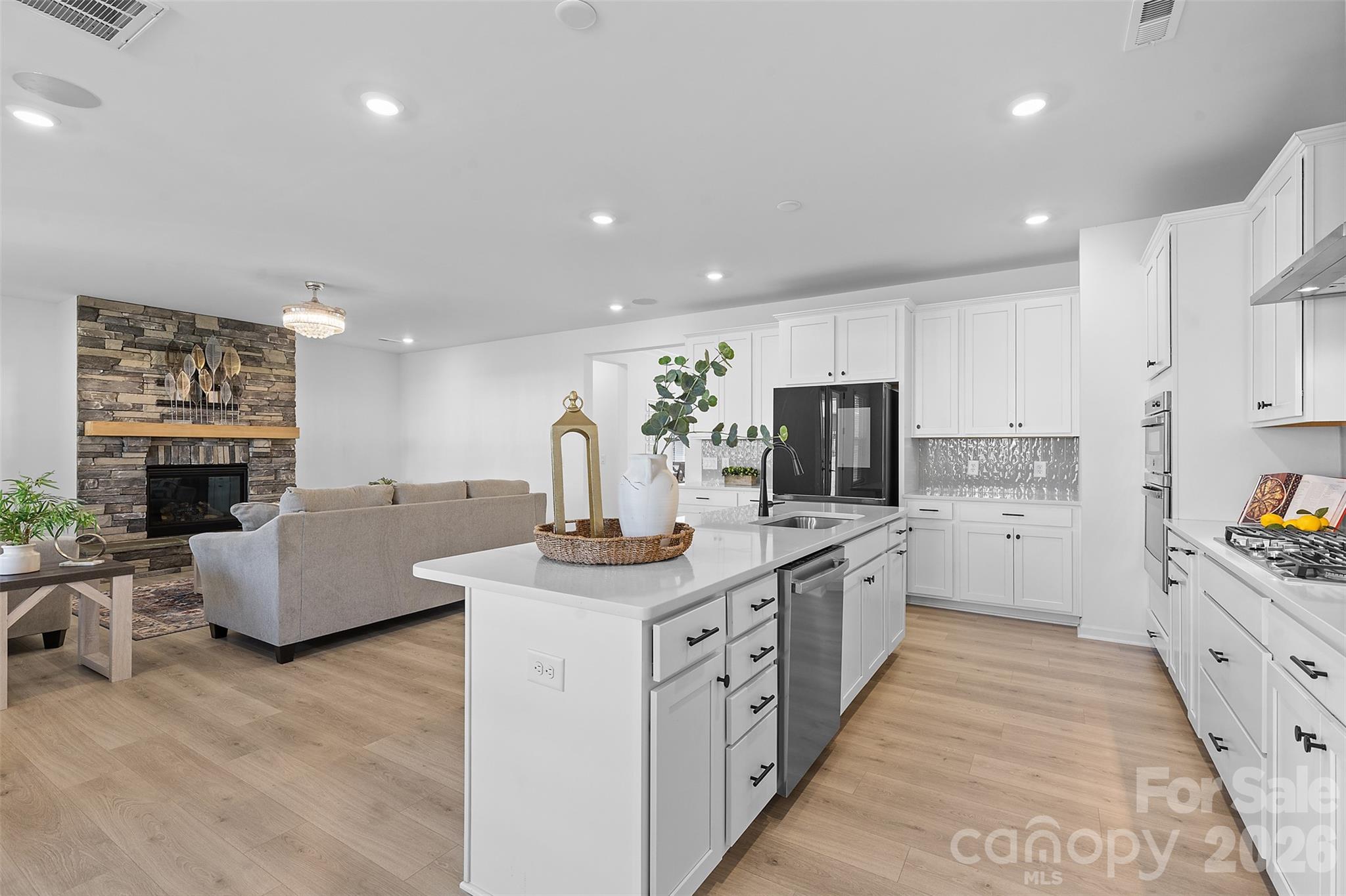 1170 Sugar Crk Road Fort Mill, SC 29707 - Photo 16 of 47 a large kitchen with stainless steel appliances granite countertop a lot of counter space and a sink
