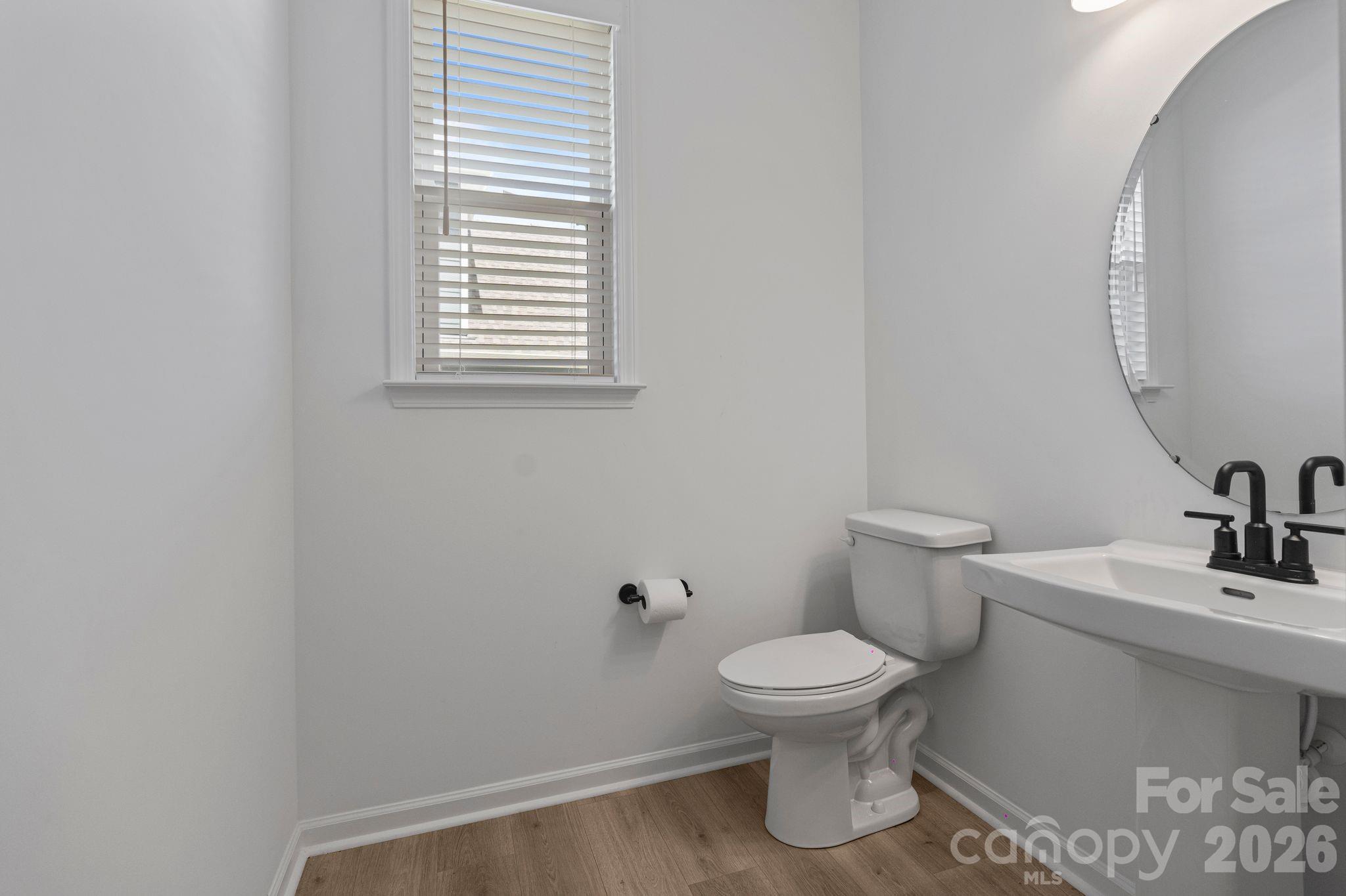 1170 Sugar Crk Road Fort Mill, SC 29707 - Photo 23 of 47 a white toilet sitting next to a bathroom sink