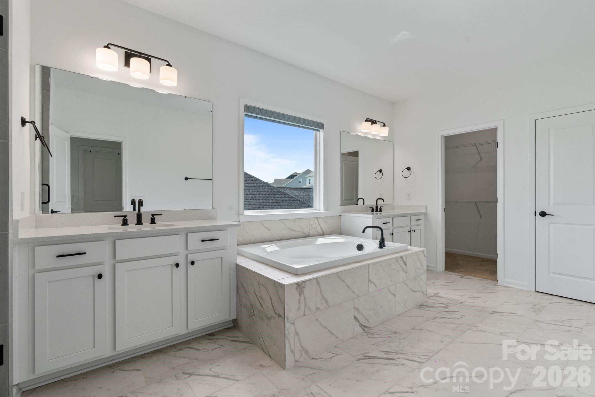 1170 Sugar Crk Road Fort Mill, SC 29707 - Photo 26 of 47 a bathroom with a granite countertop double vanity sink a mirror and a bathtub