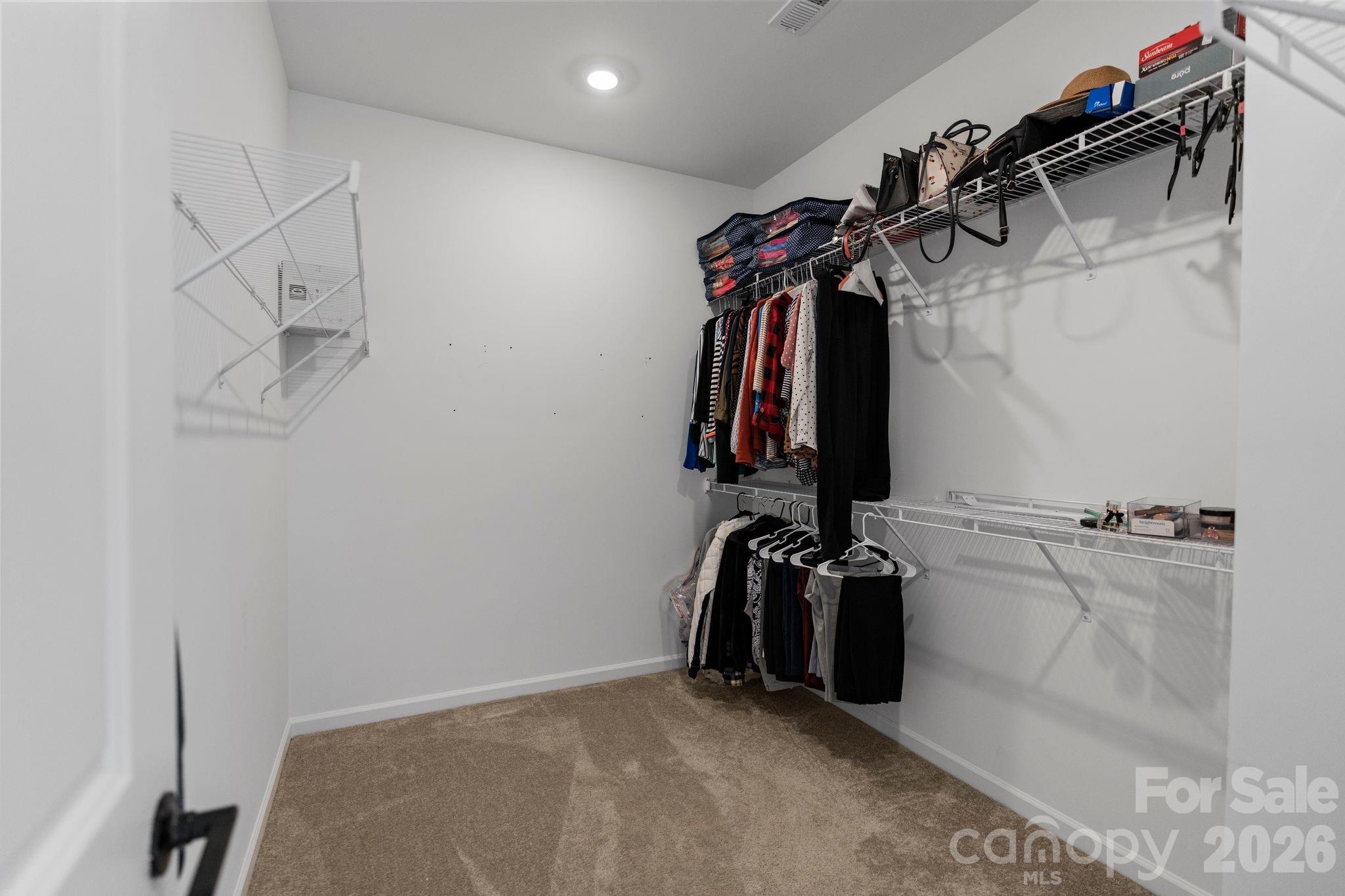 1170 Sugar Crk Road Fort Mill, SC 29707 - Photo 29 of 47 a view of walk in closet with clothes and shoes