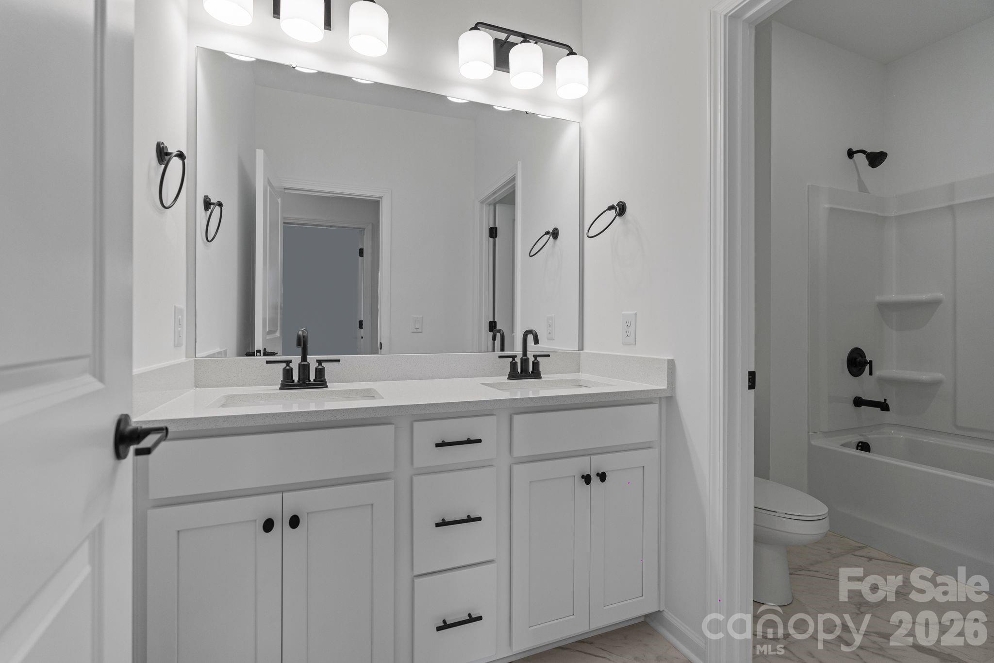 1170 Sugar Crk Road Fort Mill, SC 29707 - Photo 42 of 47 a bathroom with a granite countertop sink a toilet and a mirror