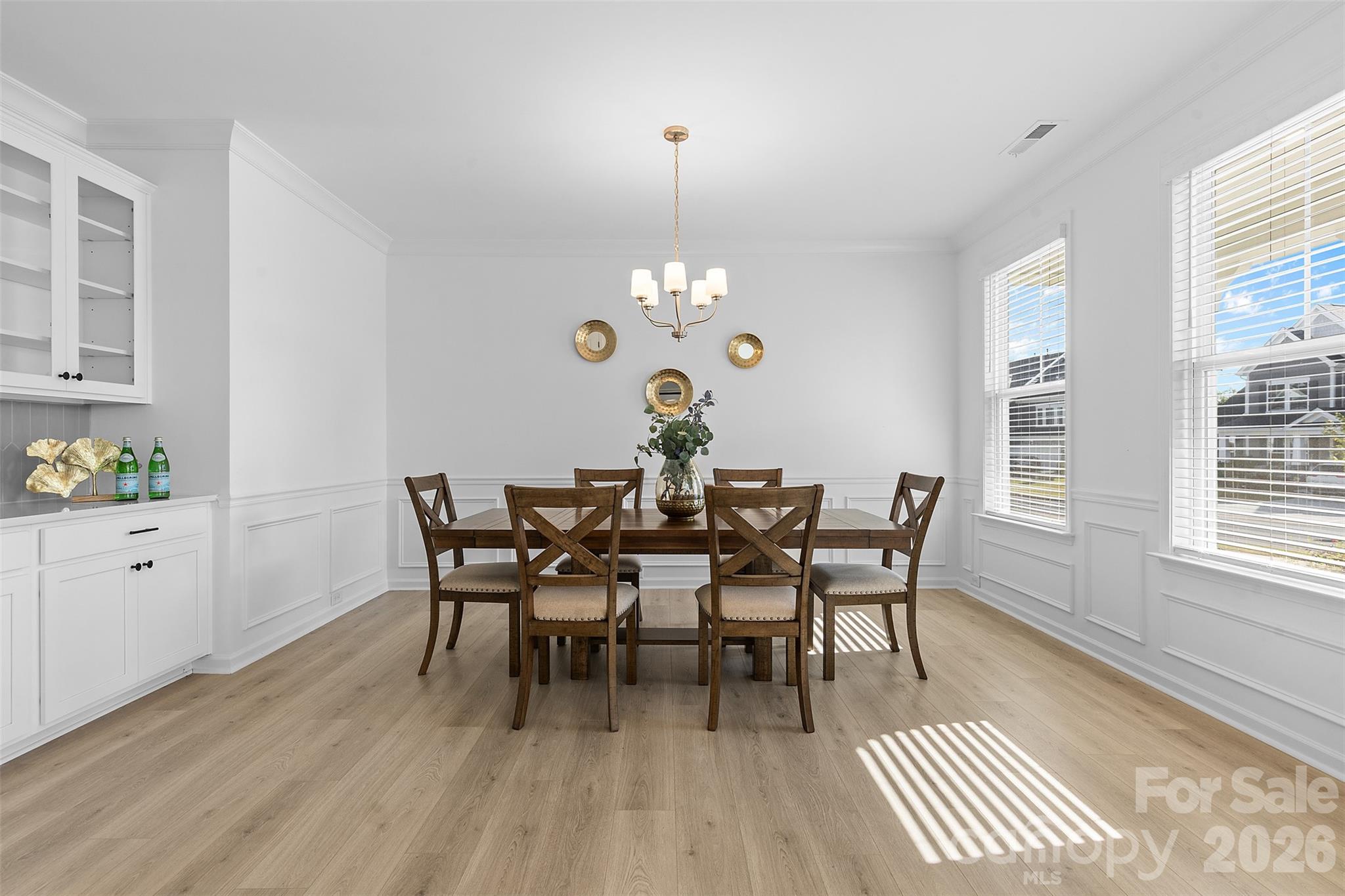 1170 Sugar Crk Road Fort Mill, SC 29707 - Photo 10 of 47 a dining room with wooden floor a chandelier a wooden table and chairs