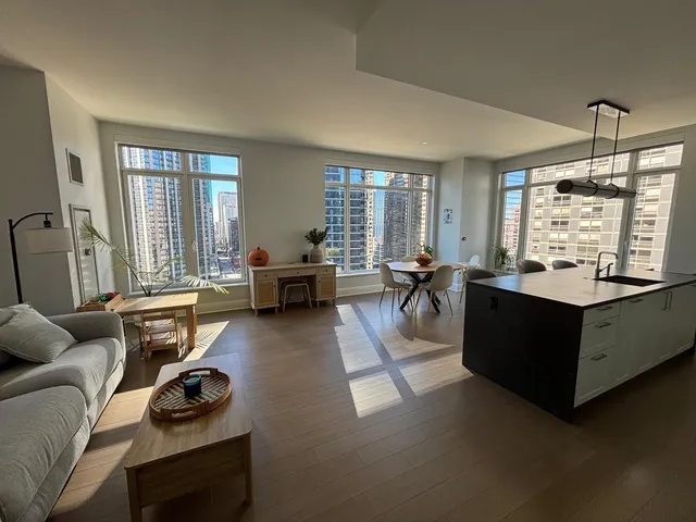 a living room with furniture window and a table