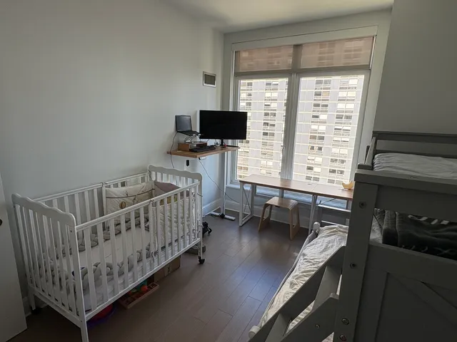 a bedroom with furniture and a window