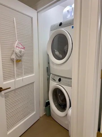 a view of a hallway with washer and dryer