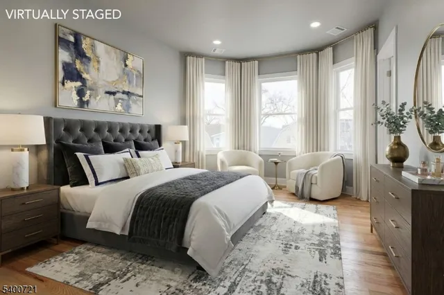 a bedroom with a large bed and a window