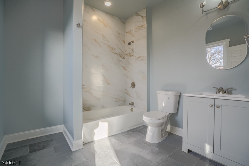 882 South 14th Street, Unit 3 Newark, NJ 07108 - Photo 5 of 20 a bathroom with a toilet sink and shower