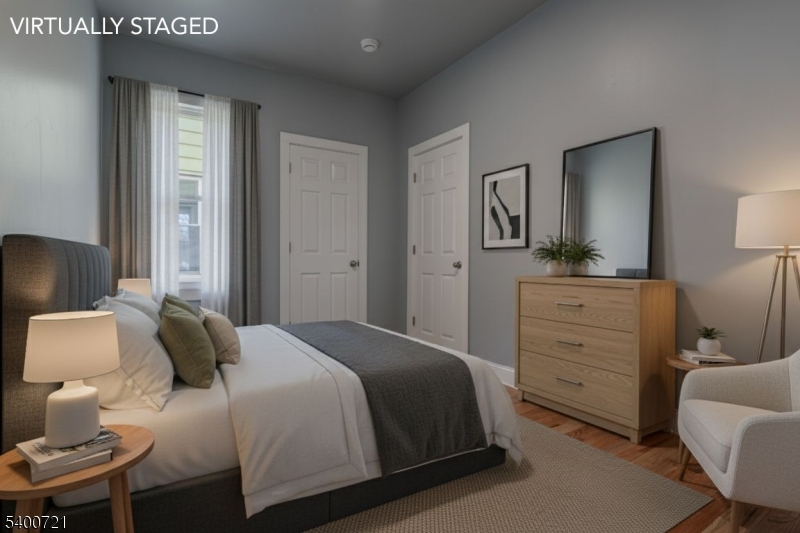 882 South 14th Street, Unit 3 Newark, NJ 07108 - Photo 6 of 20 a bedroom with a bed and a dresser