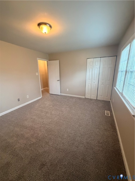 4605 Cogbill Road Richmond, VA 23234 - Photo 15 of 20 Spacious room featuring neutral carpeting and ligh