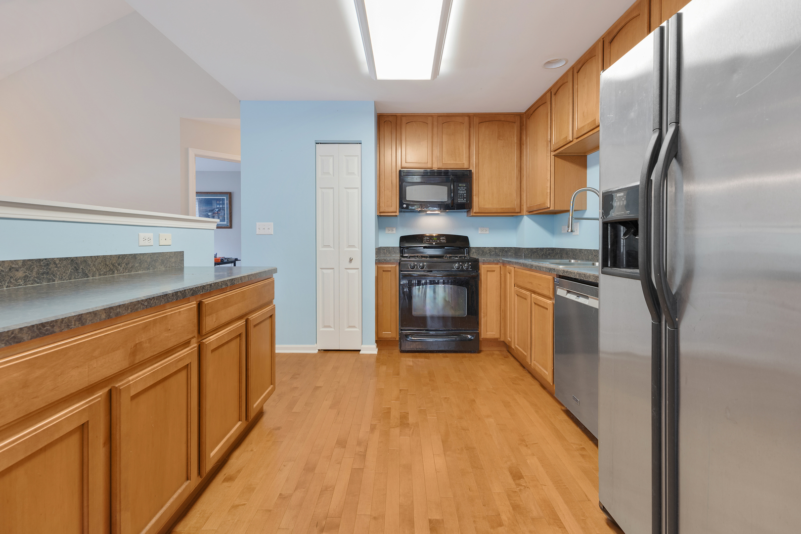 1641 Sandcastle Lane Pingree Grove, IL 60140 - Photo 12 of 15 a kitchen with stainless steel appliances granite countertop a refrigerator a stove top oven a sink and dishwasher