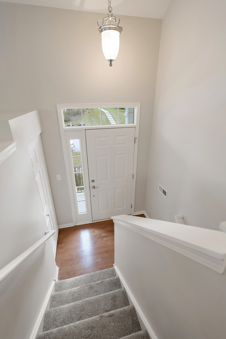 1641 Sandcastle Lane Pingree Grove, IL 60140 - Photo 14 of 15 a view of an entryway with staircase