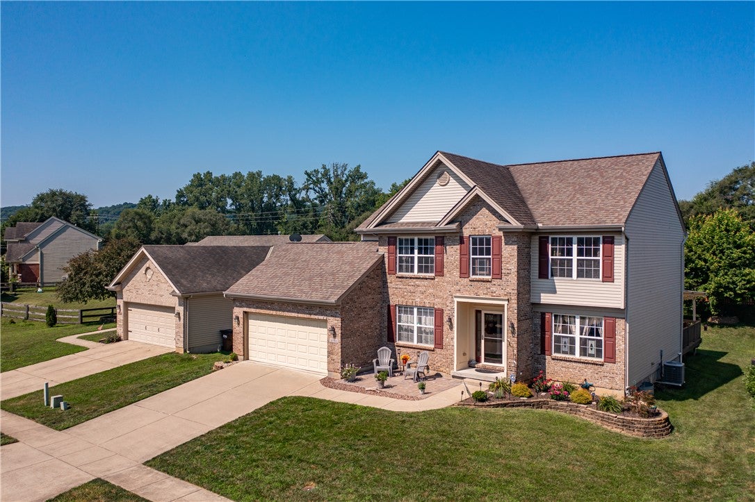 10765 Stone Ridge Way Harrison, OH 45030 - Photo 49 of 68 A classic brick exterior with inviting curb appeal and a two-car garage awaits.
