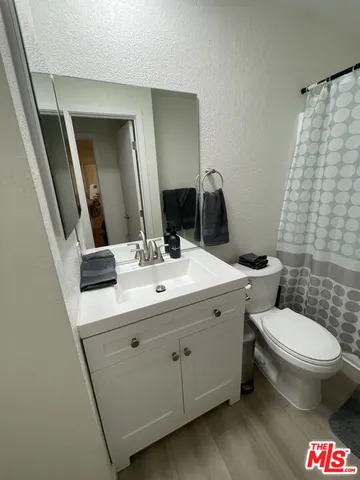 a bedroom with a bed and a cabinets