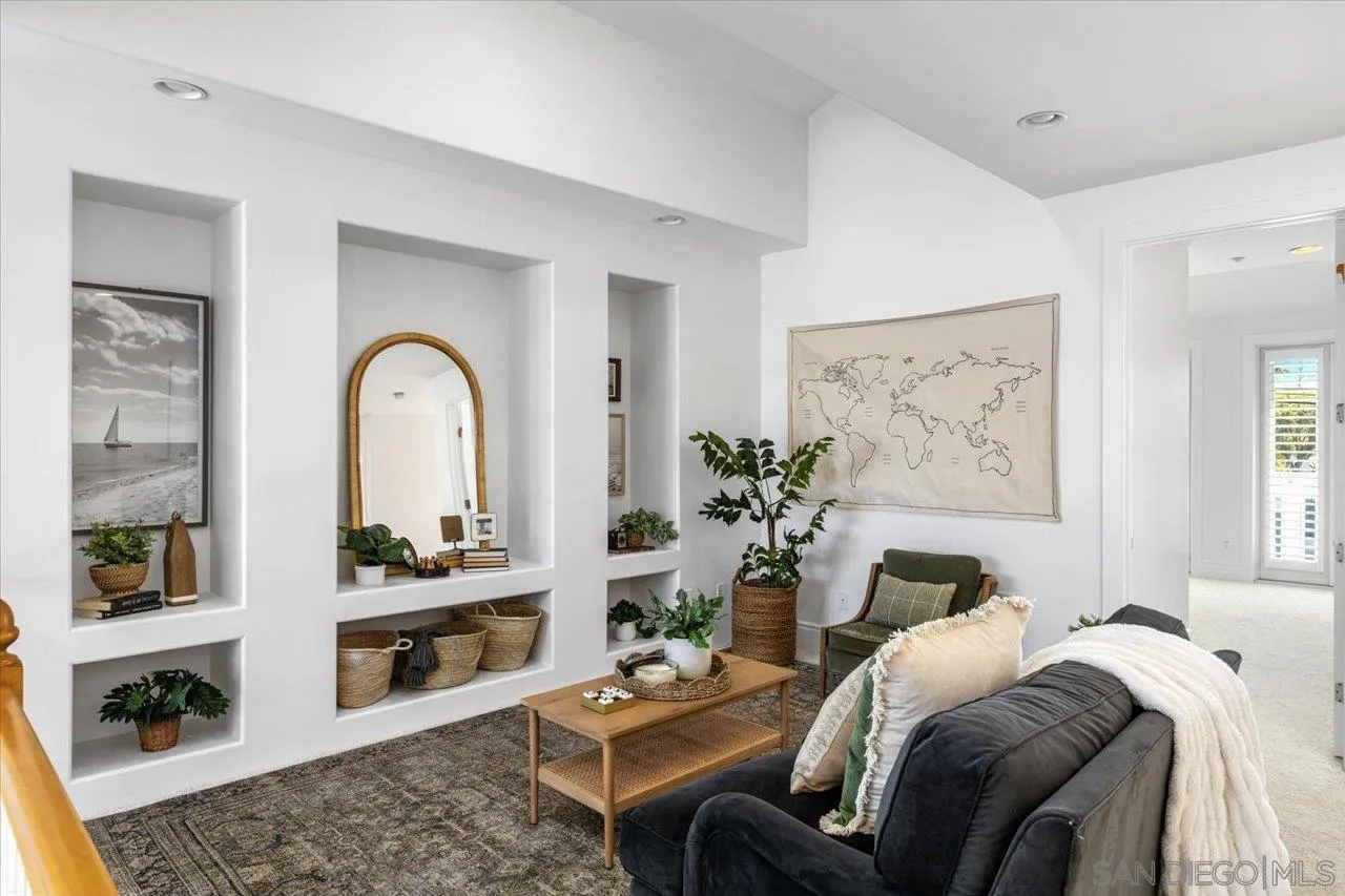 1066 Melba Road Encinitas, CA 92024 - Photo 12 of 54 a living room with furniture flowerpot and wooden floor