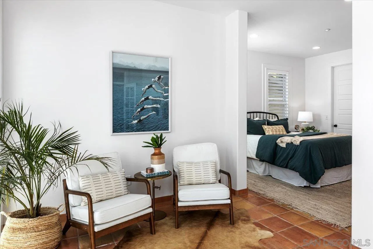 1066 Melba Road Encinitas, CA 92024 - Photo 14 of 54 a bedroom with furniture and a potted plant
