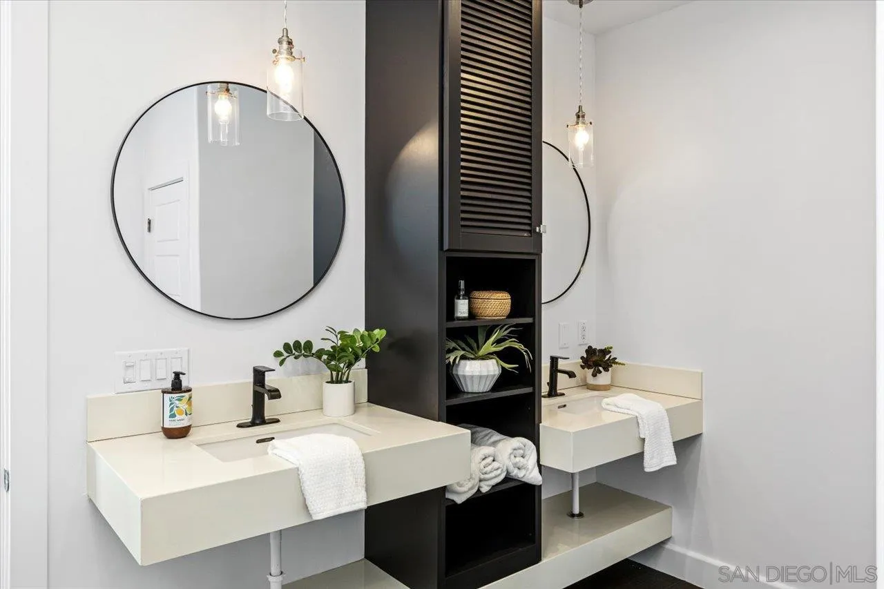 1066 Melba Road Encinitas, CA 92024 - Photo 38 of 54 a living room with furniture and a mirror