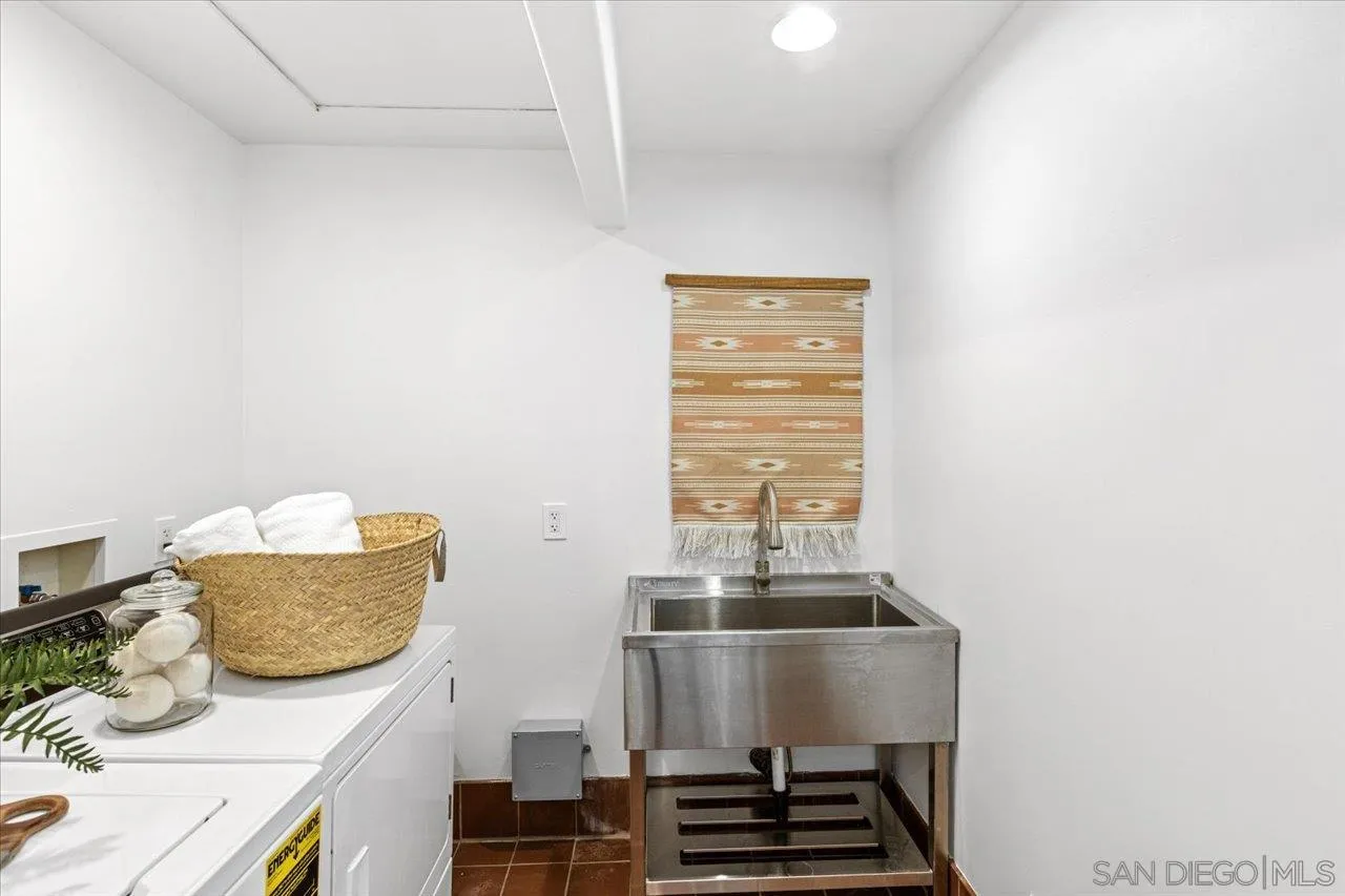 1066 Melba Road Encinitas, CA 92024 - Photo 44 of 54 a bathroom with a sink and a mirror