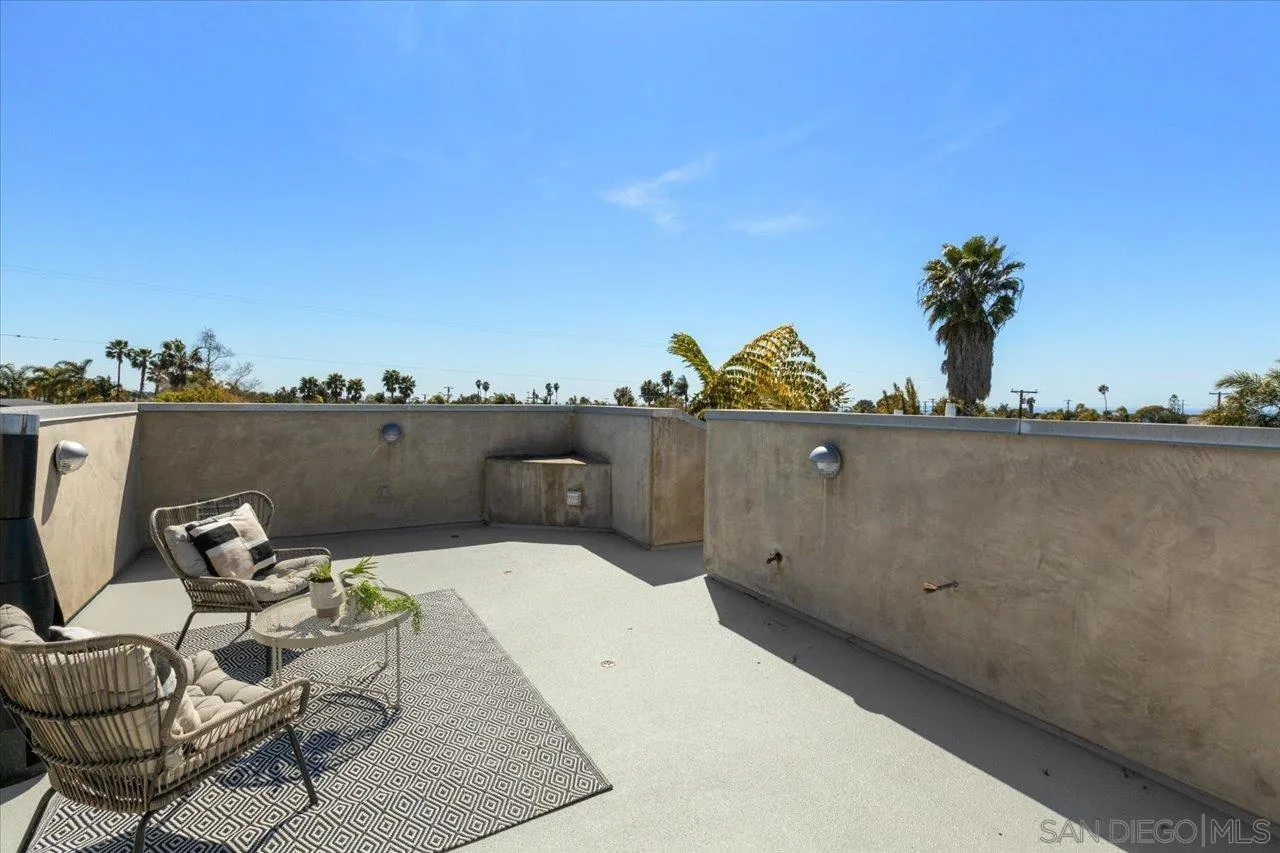 1066 Melba Road Encinitas, CA 92024 - Photo 45 of 54 a view of a terrace with a bench