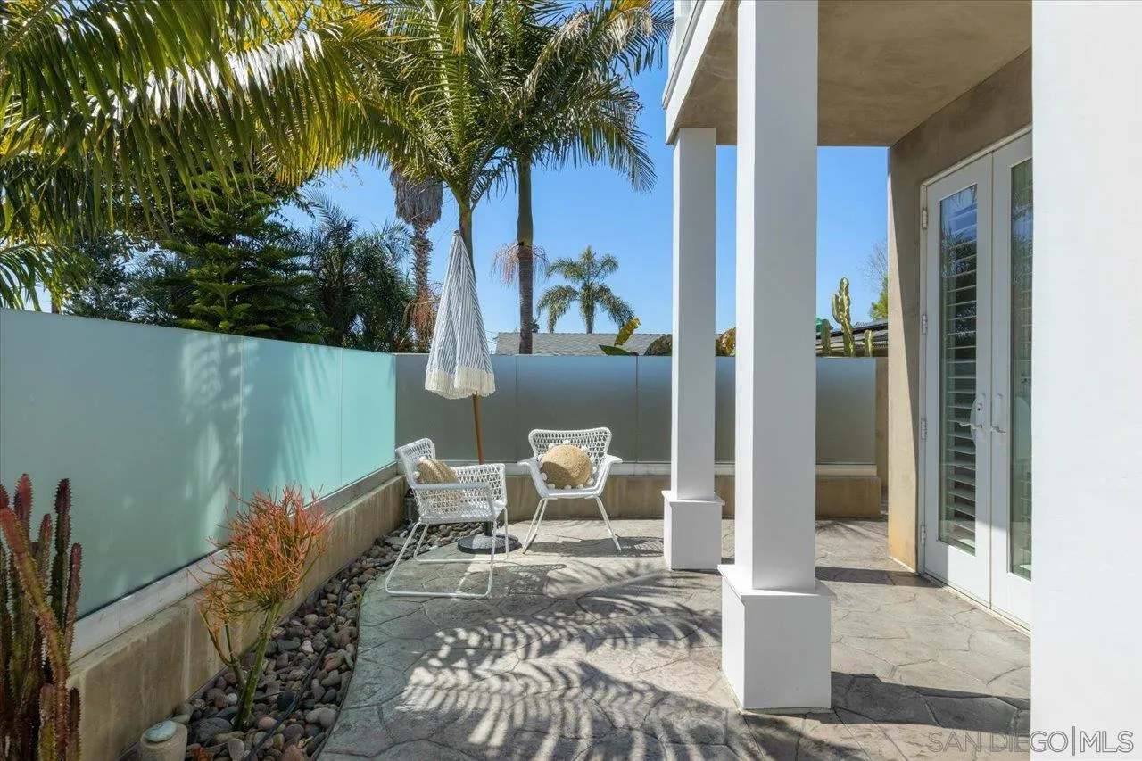 1066 Melba Road Encinitas, CA 92024 - Photo 48 of 54 a view of a porch with chairs and potted plants