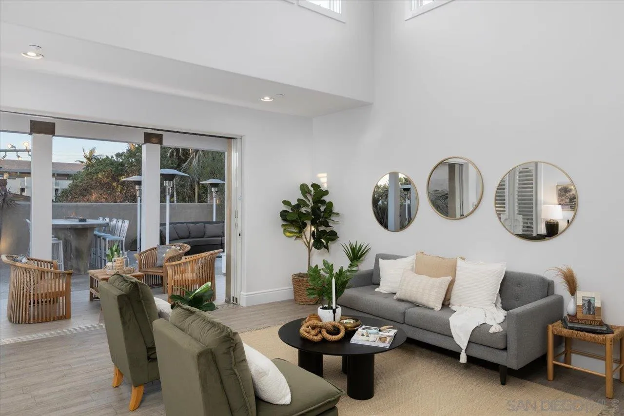 1066 Melba Road Encinitas, CA 92024 - Photo 7 of 54 a living room with furniture potted plant and windows