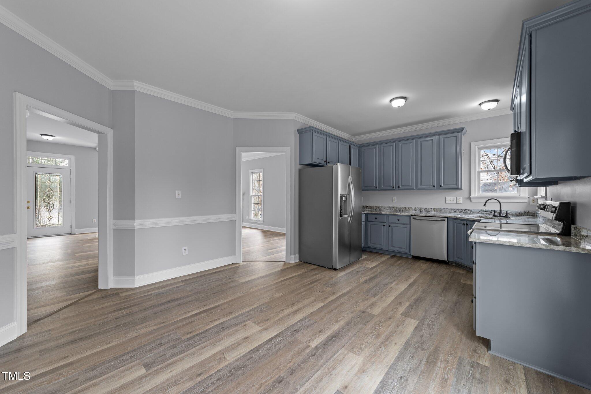 3525 La Costa Way Raleigh, NC 27610 - Photo 11 of 45 a kitchen with stainless steel appliances a refrigerator and a sink
