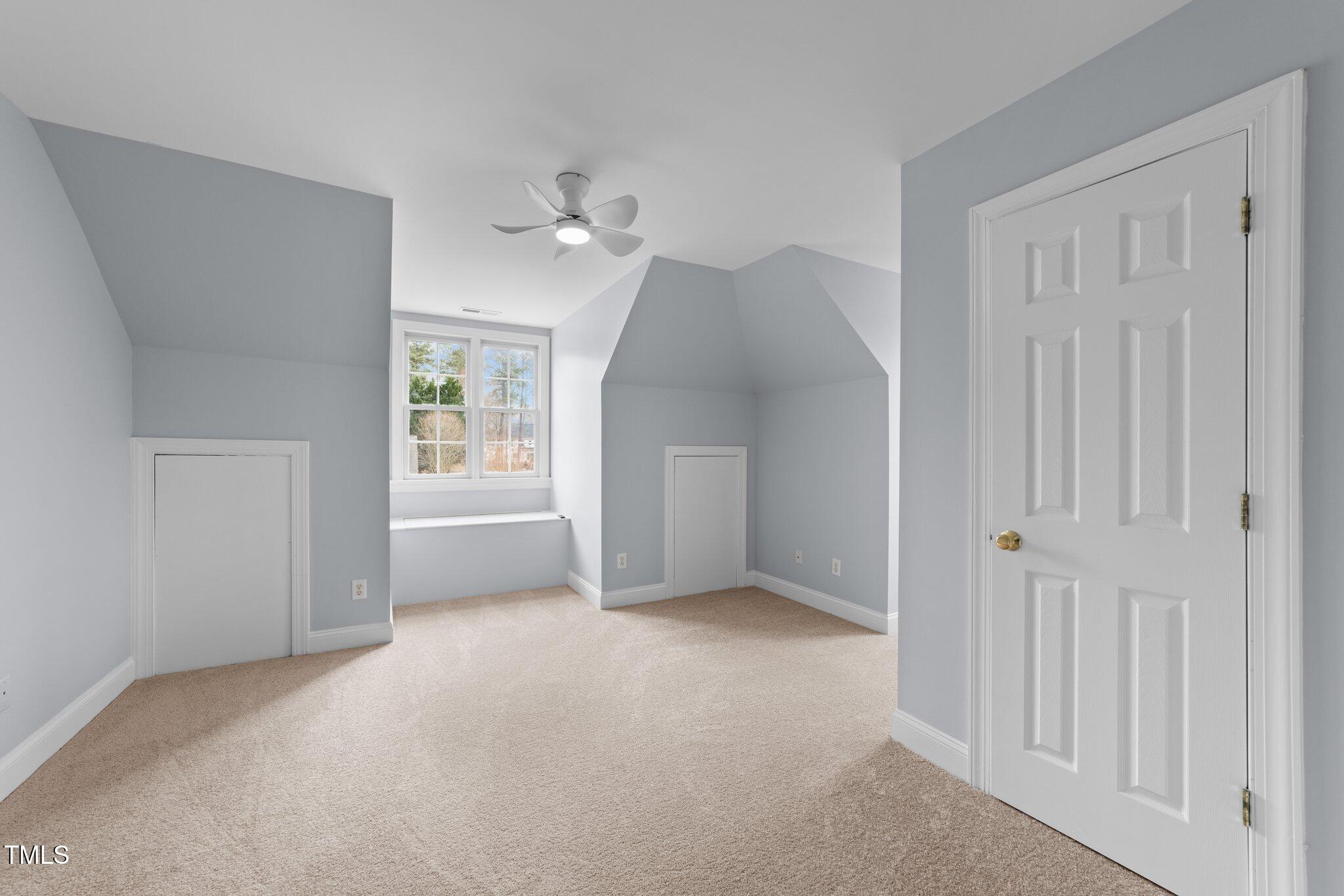 3525 La Costa Way Raleigh, NC 27610 - Photo 20 of 45 a view of a big room with windows and chandelier fan