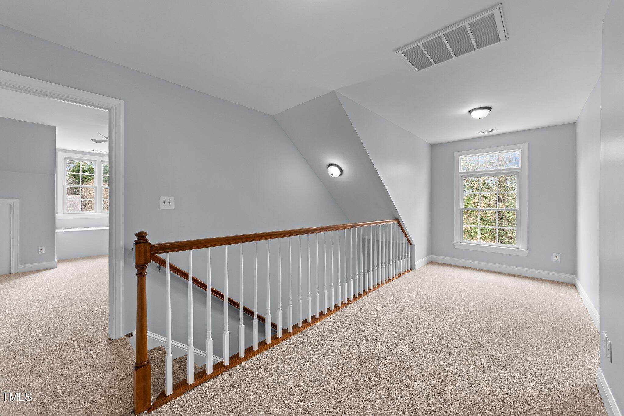 3525 La Costa Way Raleigh, NC 27610 - Photo 23 of 45 a view of hallway with bedroom and windows