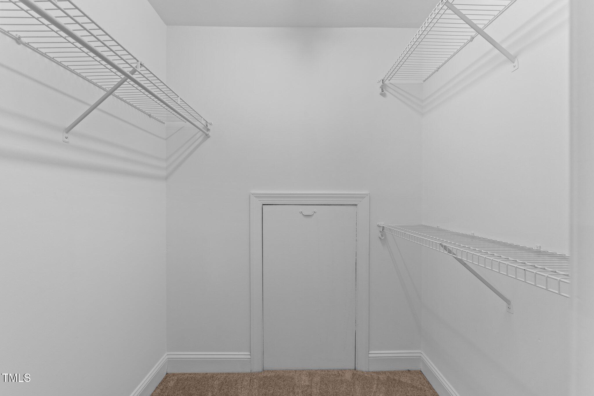 3525 La Costa Way Raleigh, NC 27610 - Photo 25 of 45 a view of a room with racks on the wall