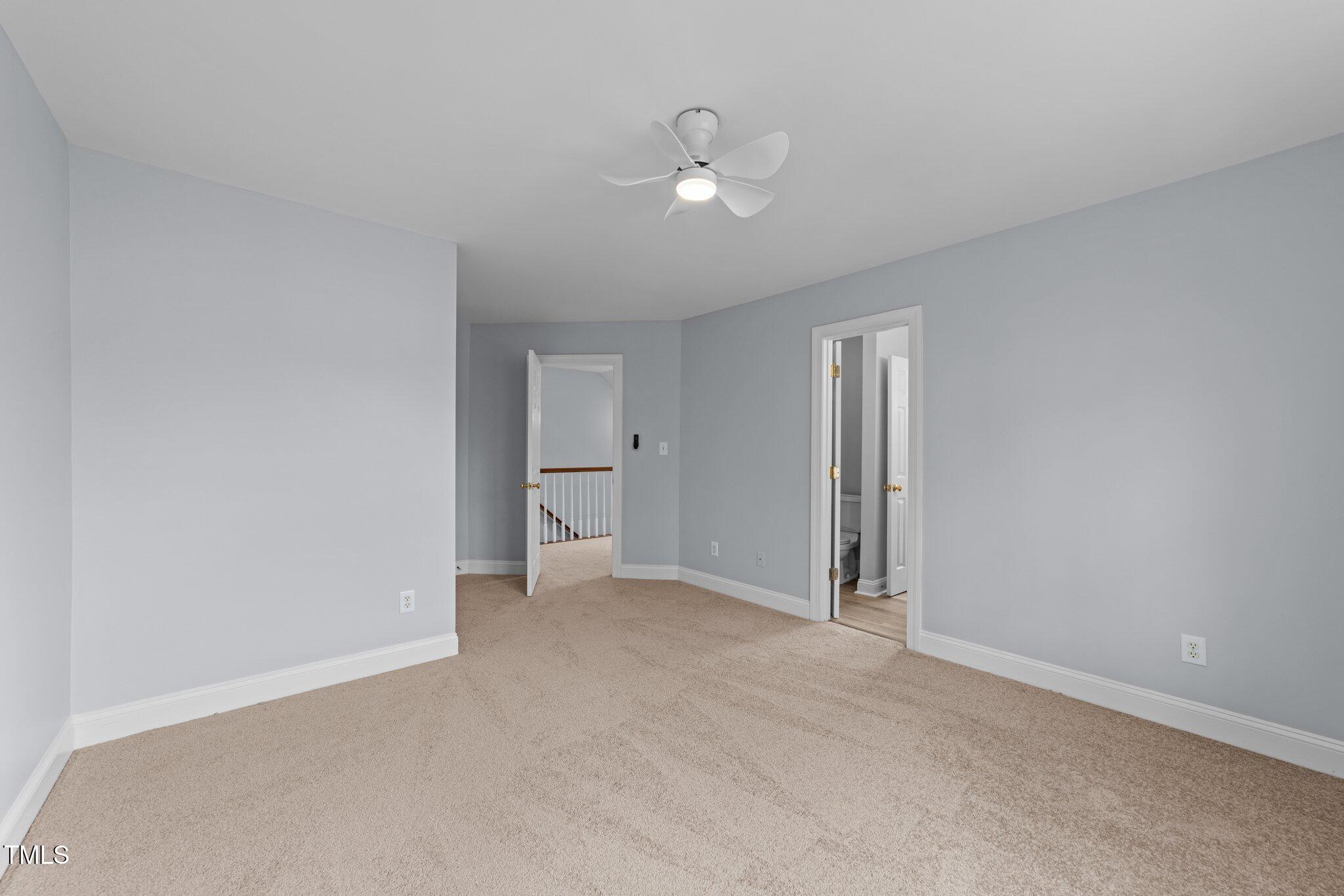 3525 La Costa Way Raleigh, NC 27610 - Photo 26 of 45 a view of an empty room with a fan