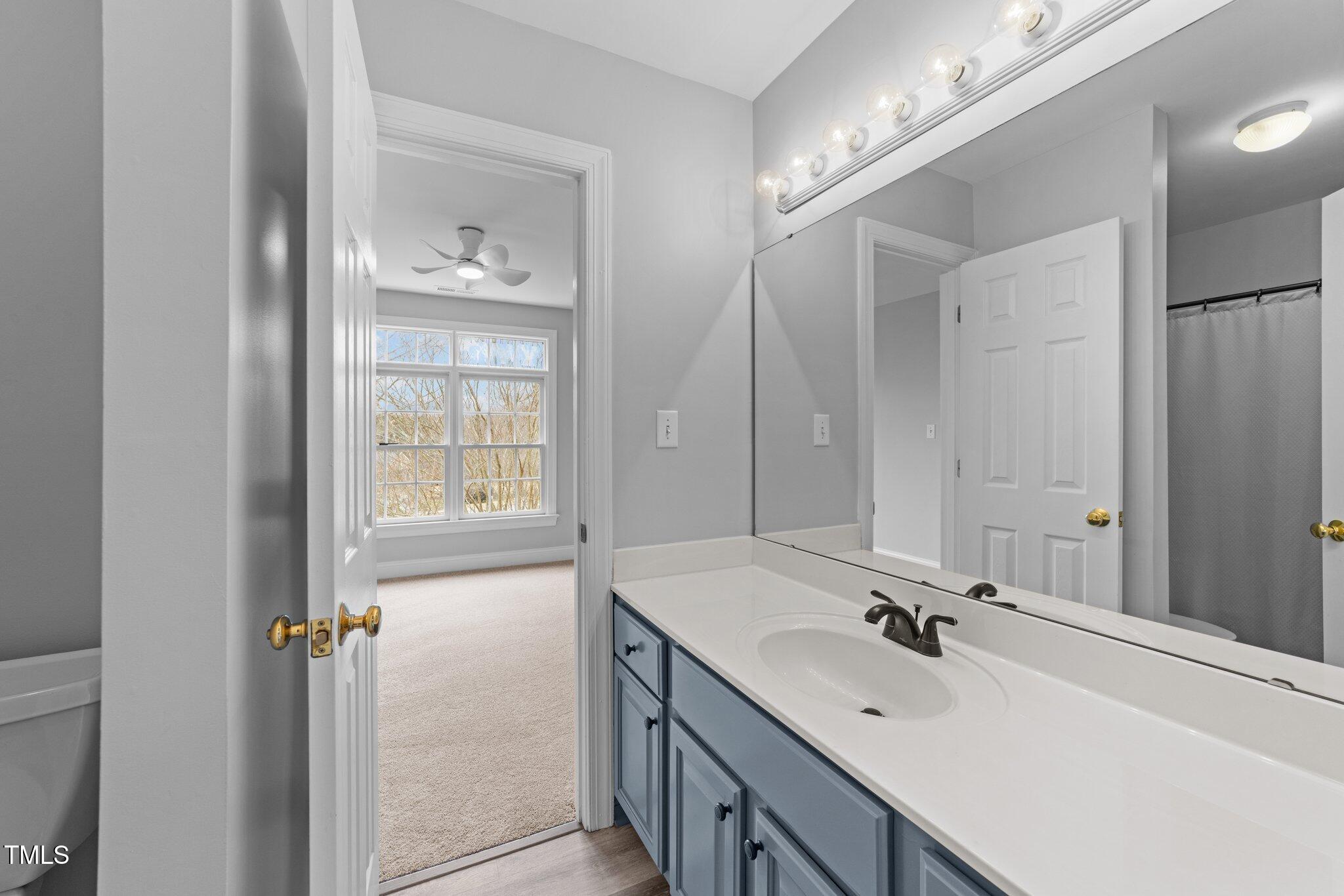 3525 La Costa Way Raleigh, NC 27610 - Photo 27 of 45 a bathroom with a sink vanity and mirror
