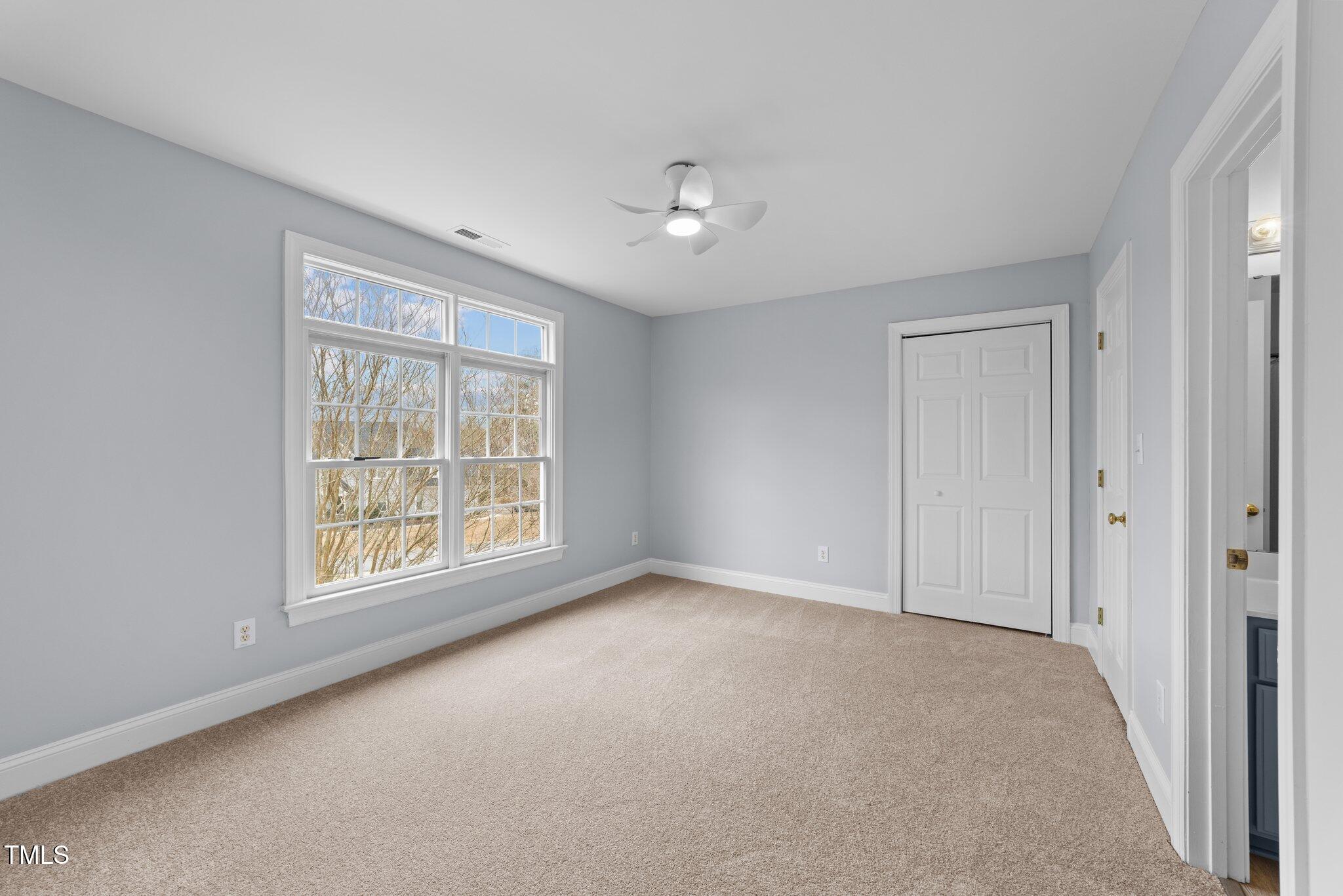 3525 La Costa Way Raleigh, NC 27610 - Photo 29 of 45 an empty room with windows and closet