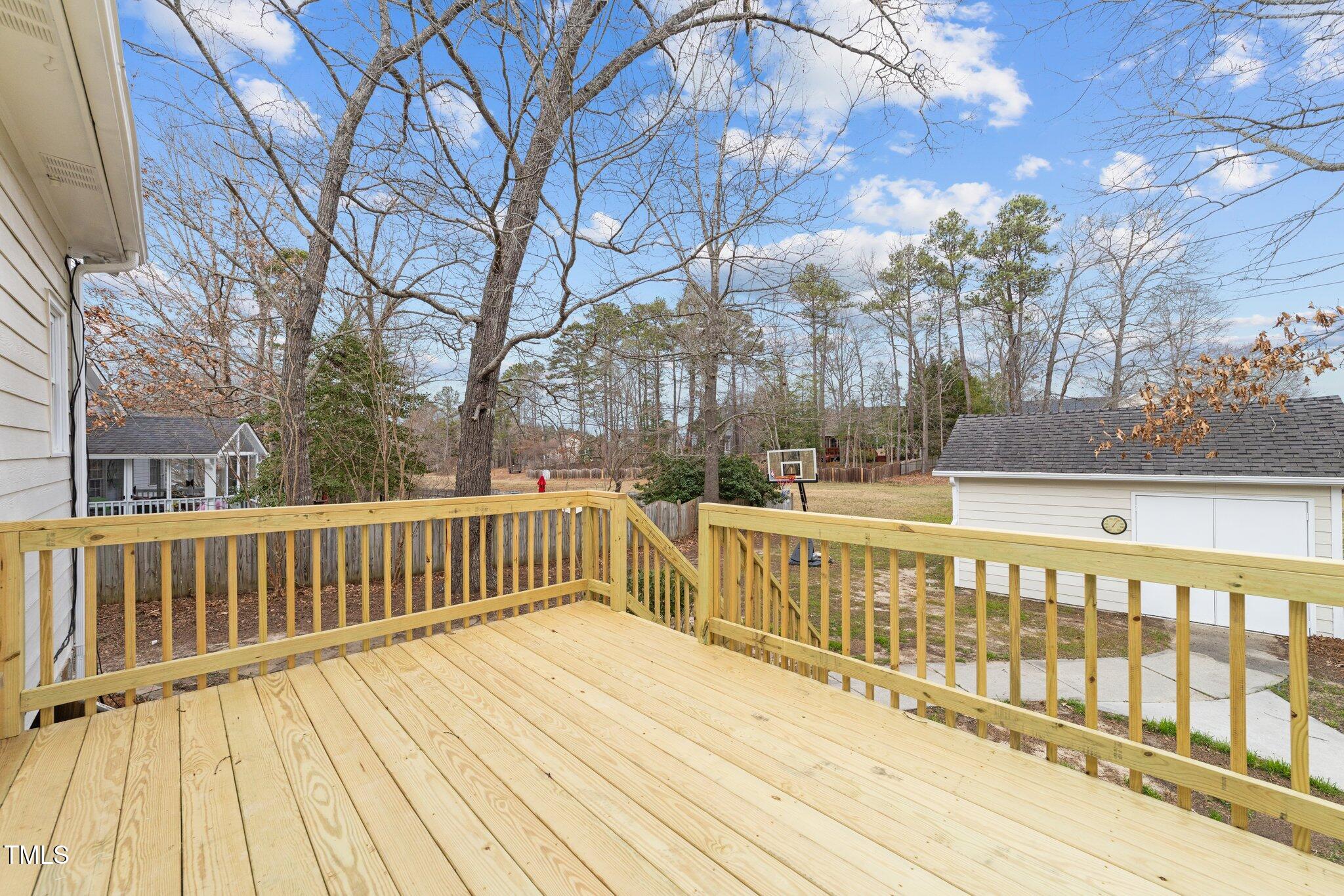 3525 La Costa Way Raleigh, NC 27610 - Photo 31 of 45 a view of a wooden deck with large trees
