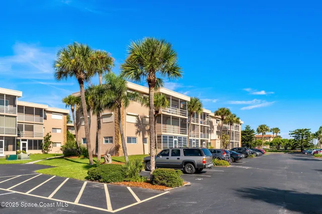 a front view of a building with street view