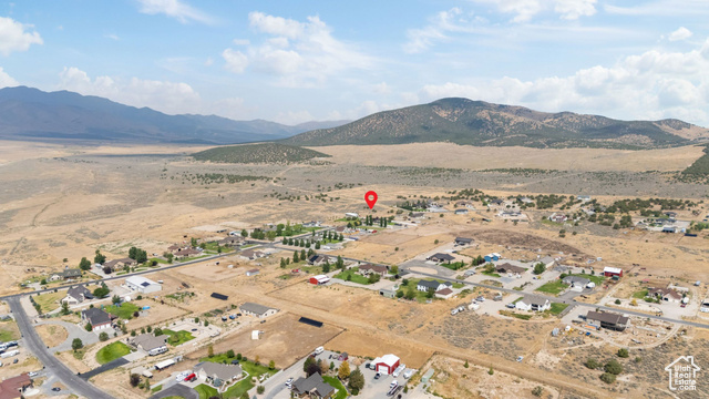 2974 West Ridgeline Road, Unit 85 Stockton, UT 84071 - Photo 10 of 23 Aerial overview of property's location featuring rural landscape and nearby suburban area