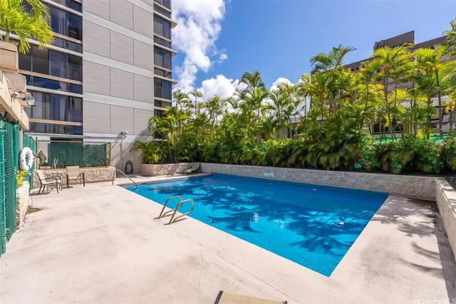 a view of swimming pool with outdoor seating