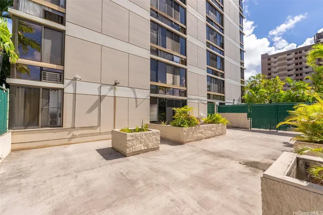 a view of a building with potted plants