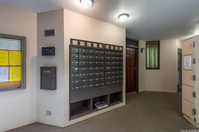 a view of water heater room with a fireplace