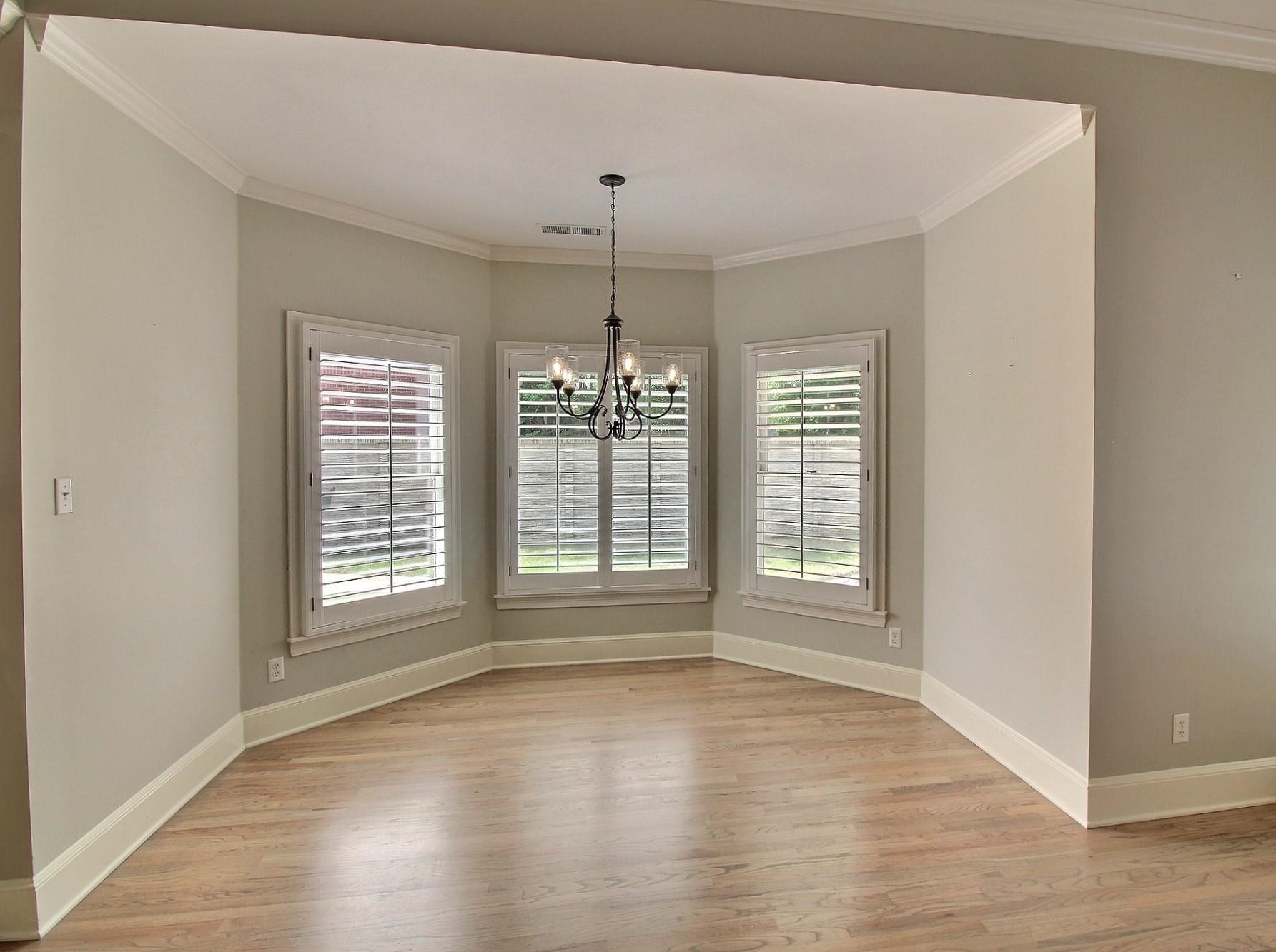 595 Kenrose Street Collierville, TN 38017 - Photo 13 of 38 a view of an empty room with wooden floor and a window