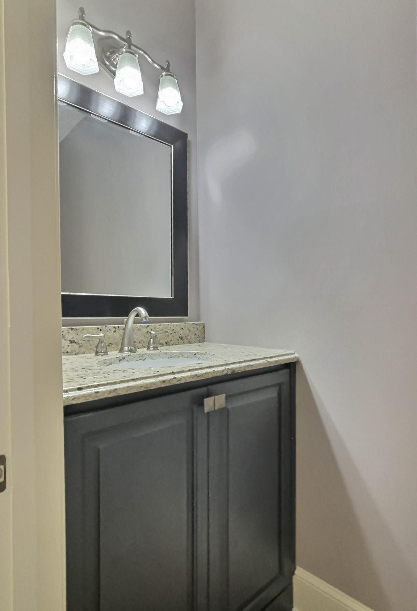 595 Kenrose Street Collierville, TN 38017 - Photo 16 of 38 a bathroom with a granite countertop sink and a mirror