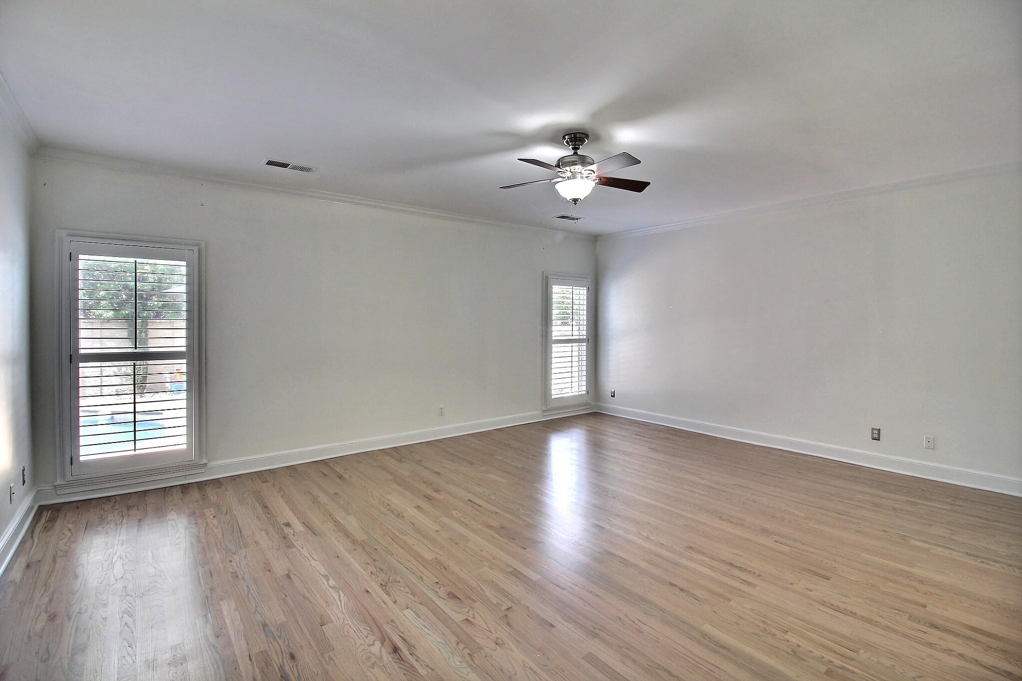 595 Kenrose Street Collierville, TN 38017 - Photo 17 of 38 a view of an empty room with a window and wooden floor