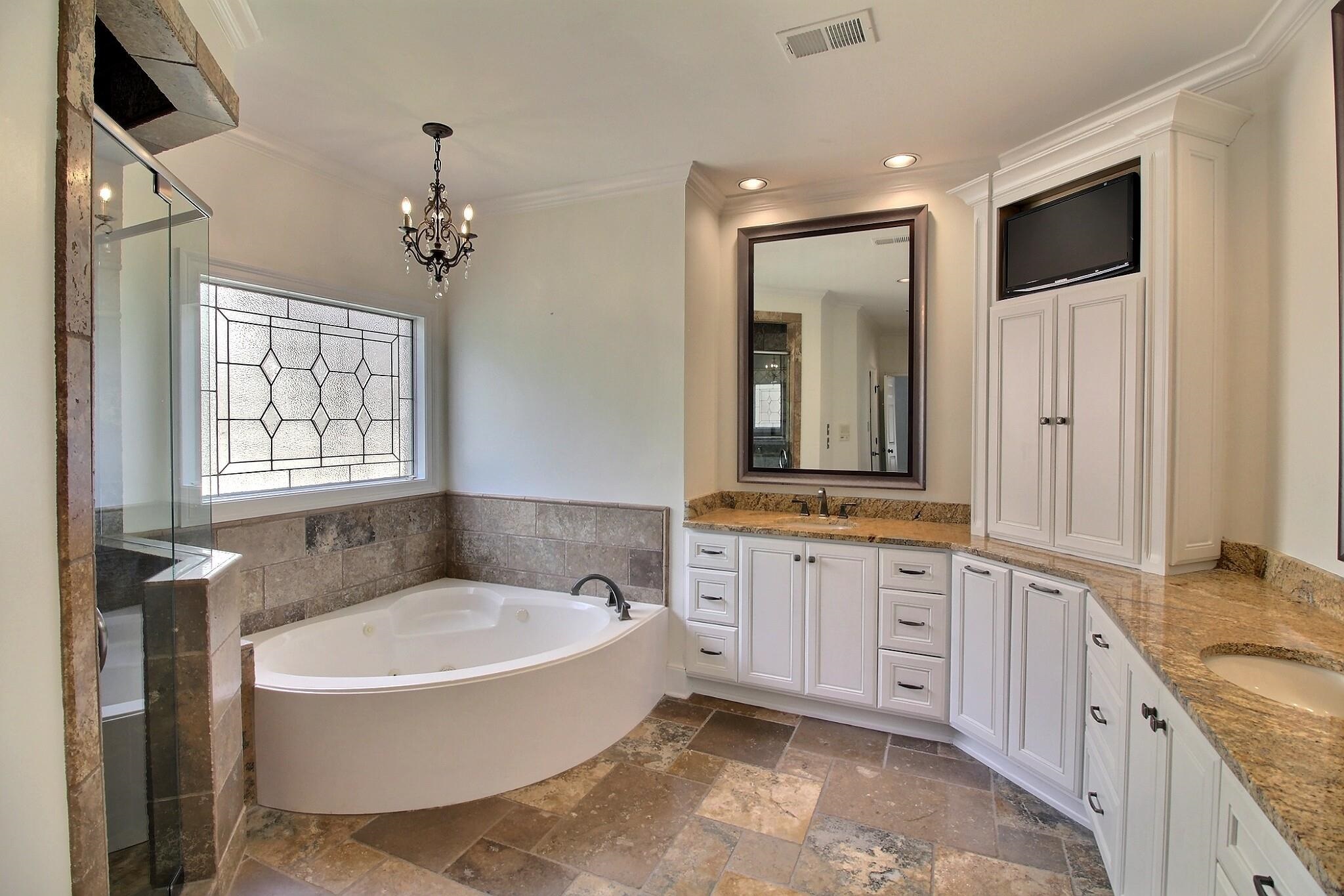 595 Kenrose Street Collierville, TN 38017 - Photo 19 of 38 a spacious bathroom with a granite countertop tub sink and mirror